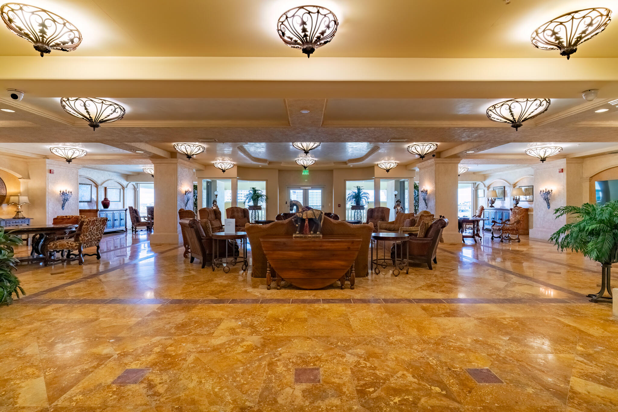 770 Harbor Boulevard, Unit 7E Destin, FL 32541 - Photo 43 of 50 a living room with lots of chairs and a chandelier