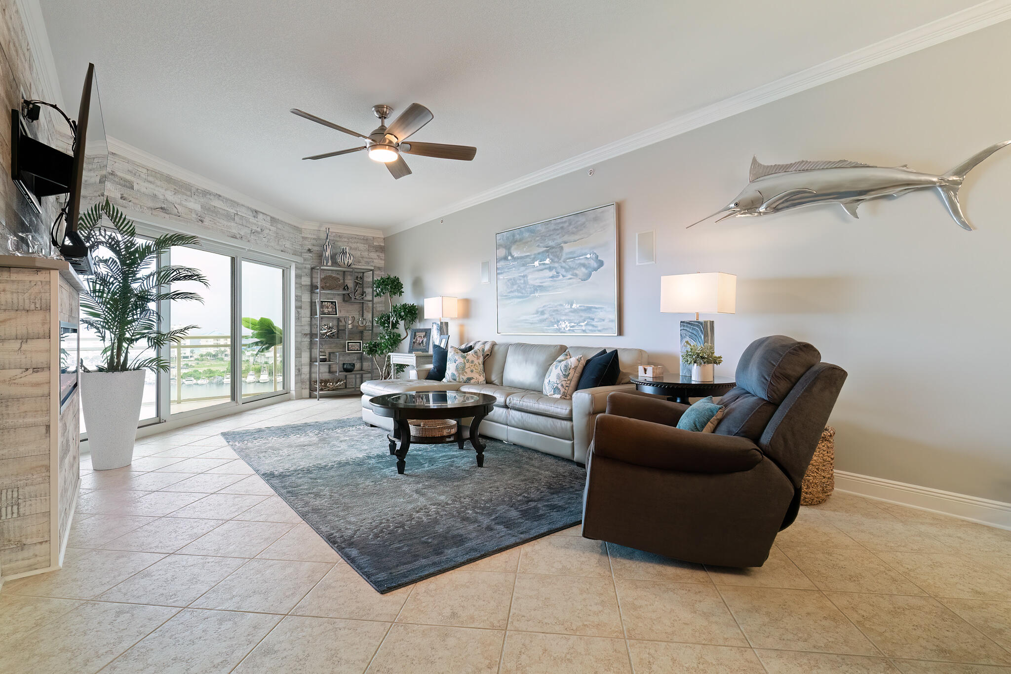 770 Harbor Boulevard, Unit 7E Destin, FL 32541 - Photo 6 of 50 a living room with furniture a flat screen tv and a window