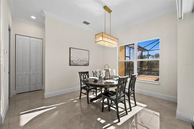 a view of a dining room with furniture window and outside view