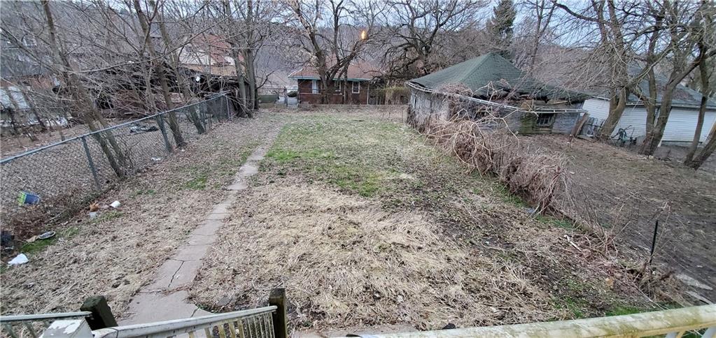631 Reed Avenue Monessen, PA 15062 - Photo 2 of 14 a view of a yard with wooden fence