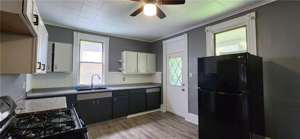 631 Reed Avenue Monessen, PA 15062 - Photo 3 of 14 a kitchen with a sink stainless steel appliances and cabinets