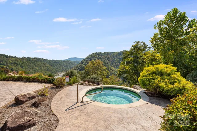 a view of a backyard with sitting area