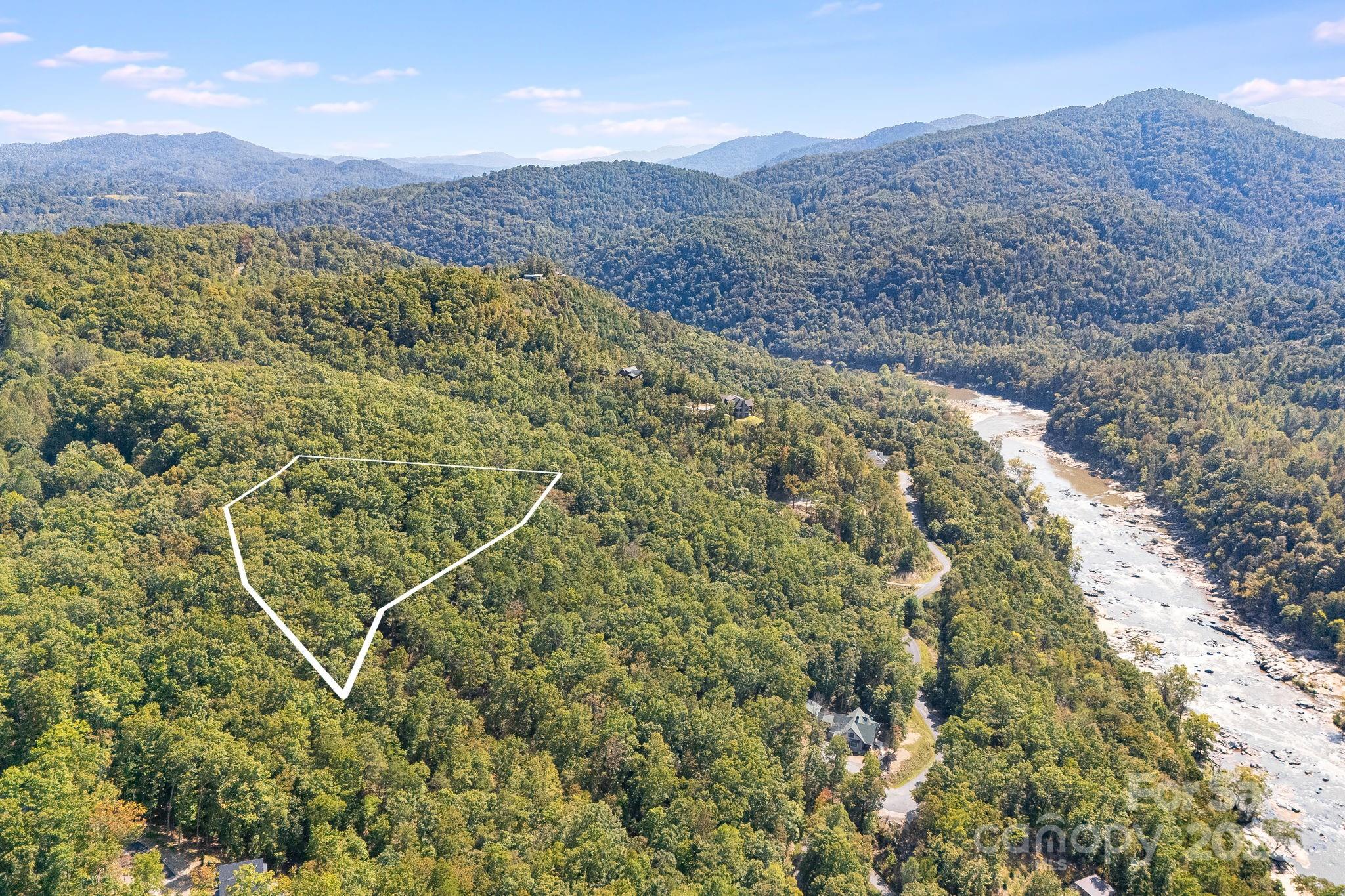 111 Wild Turkey Loop Marshall, NC 28753 - Photo 3 of 19 a view of a lush green field with mountains in the background