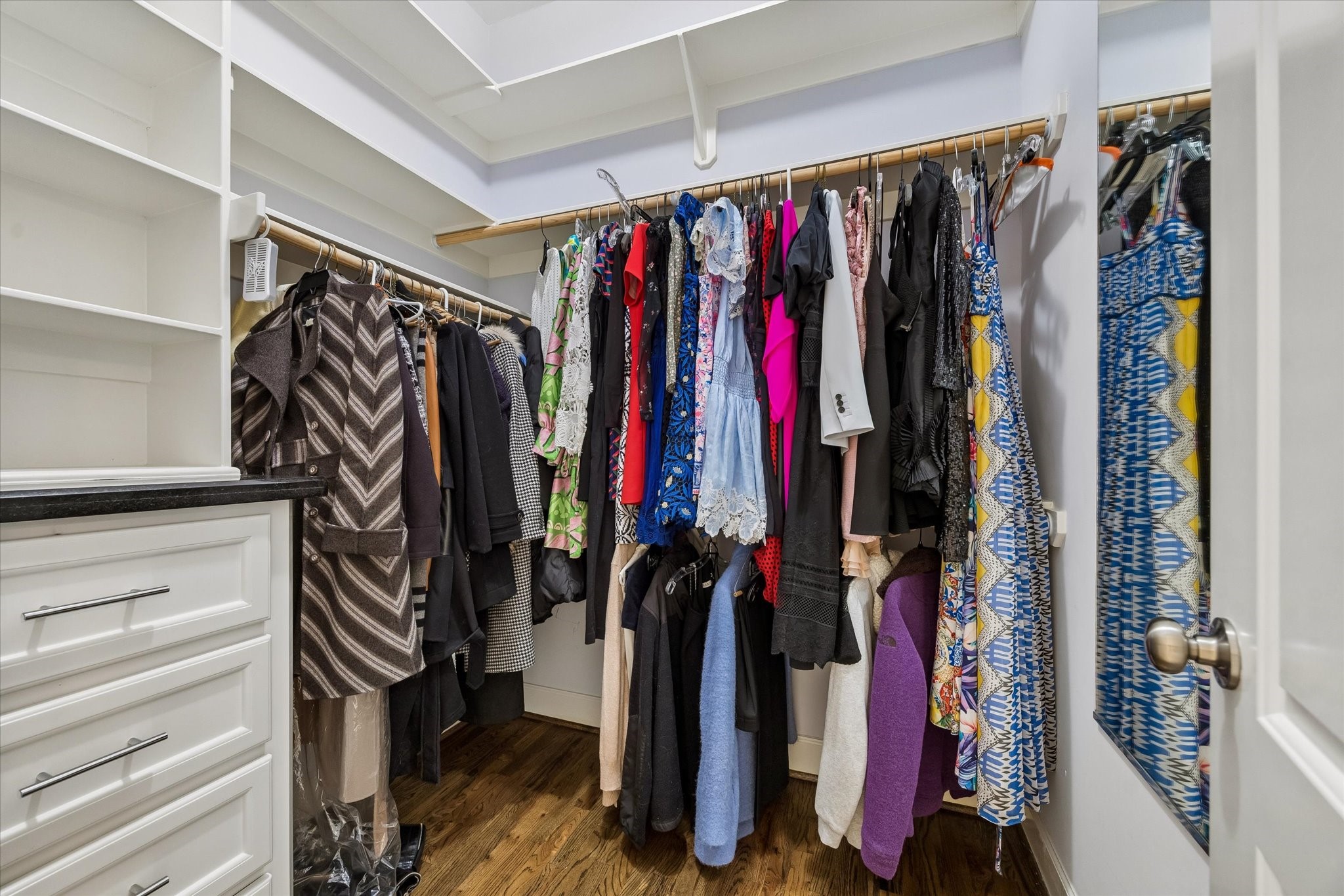 609 Rutland Street, Unit A Houston, TX 77007 - Photo 20 of 30 a view of walk in closet with clothes