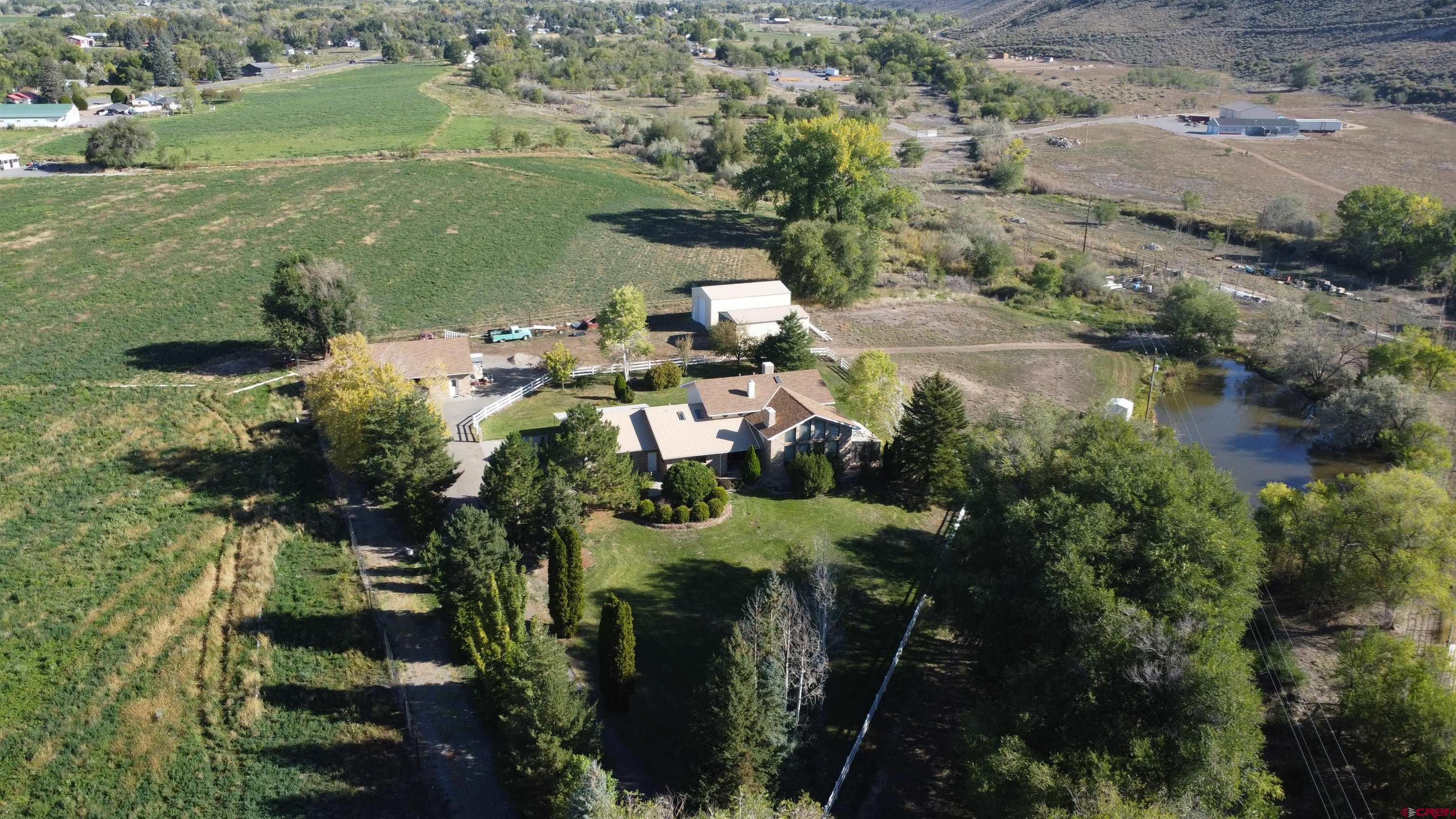 21855 Newland Road Eckert, CO 81418 - Photo 11 of 13 an aerial view of residential houses with outdoor space and trees