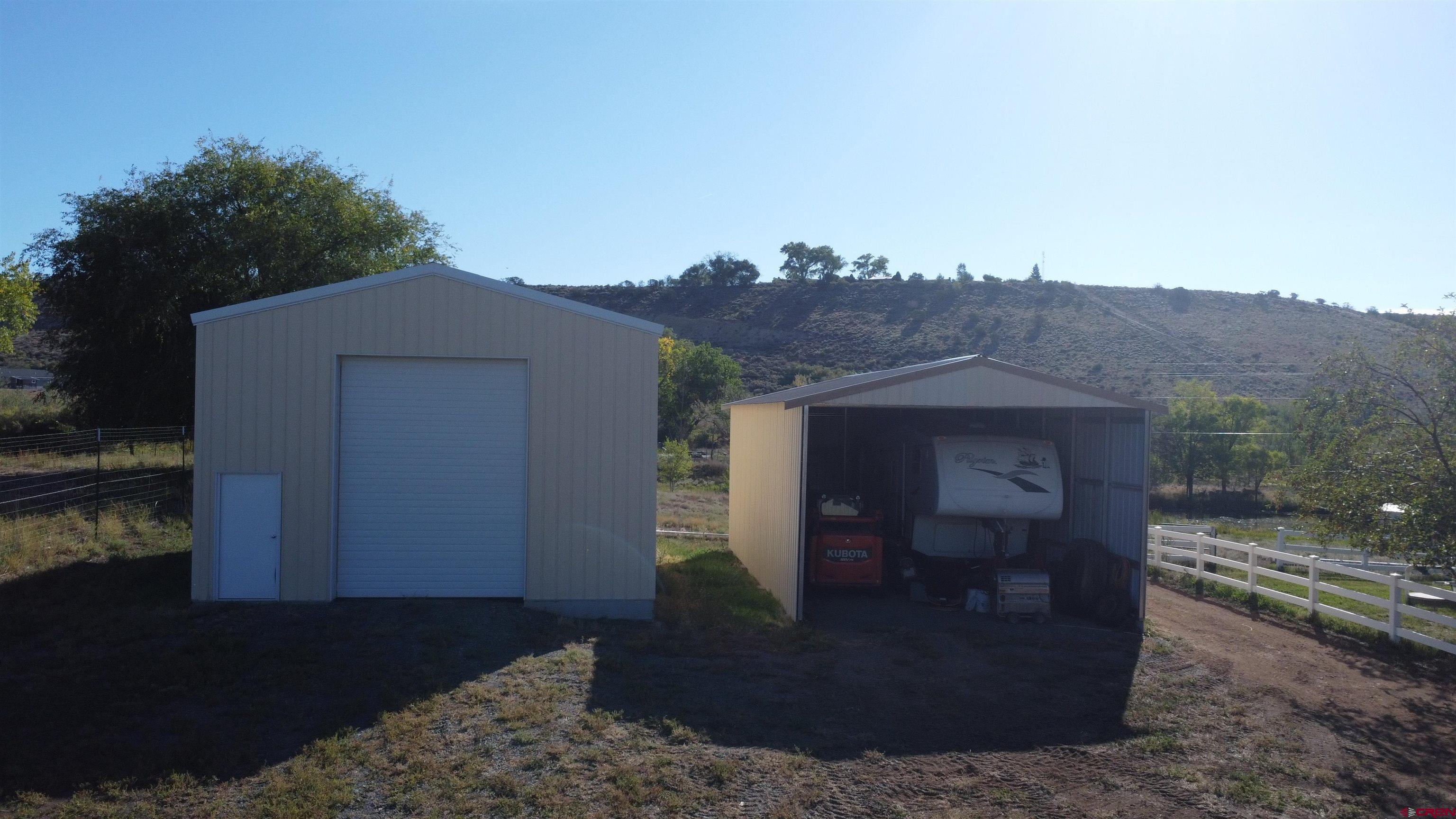 21855 Newland Road Eckert, CO 81418 - Photo 12 of 13 a view of a house with a yard