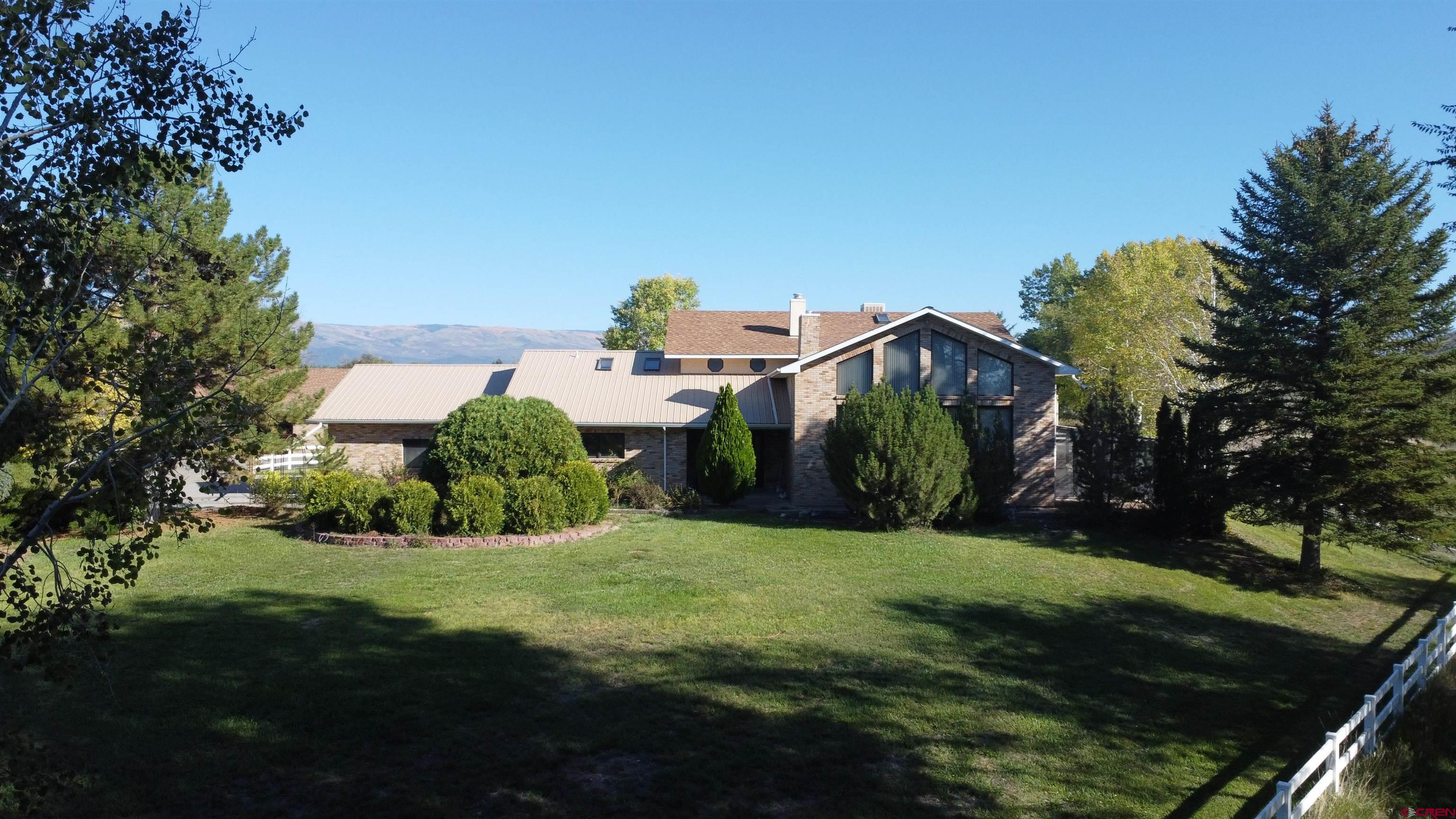 21855 Newland Road Eckert, CO 81418 - Photo 4 of 13 a view of a back yard of the house