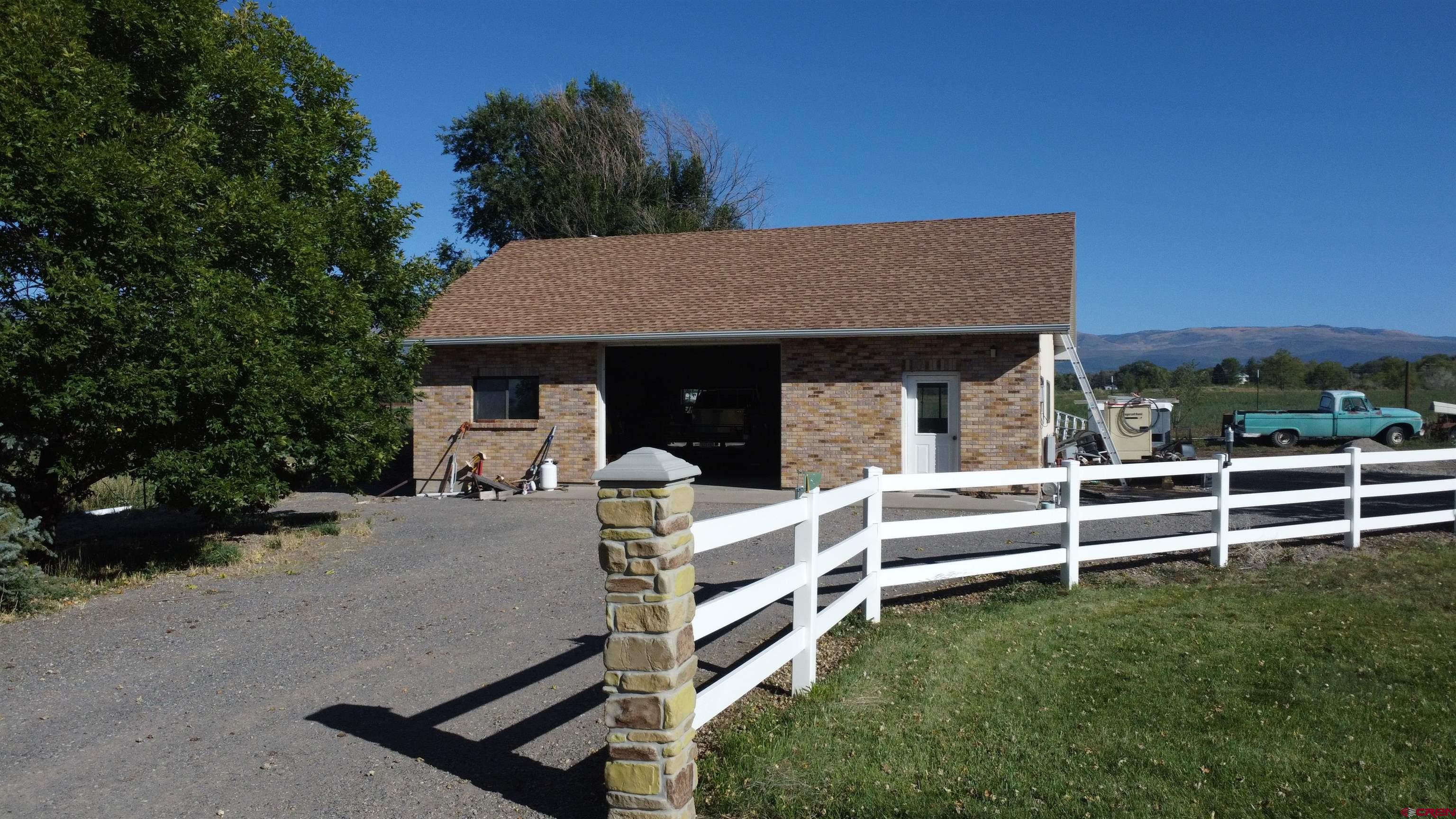 21855 Newland Road Eckert, CO 81418 - Photo 5 of 13 a view of a house with backyard and porch
