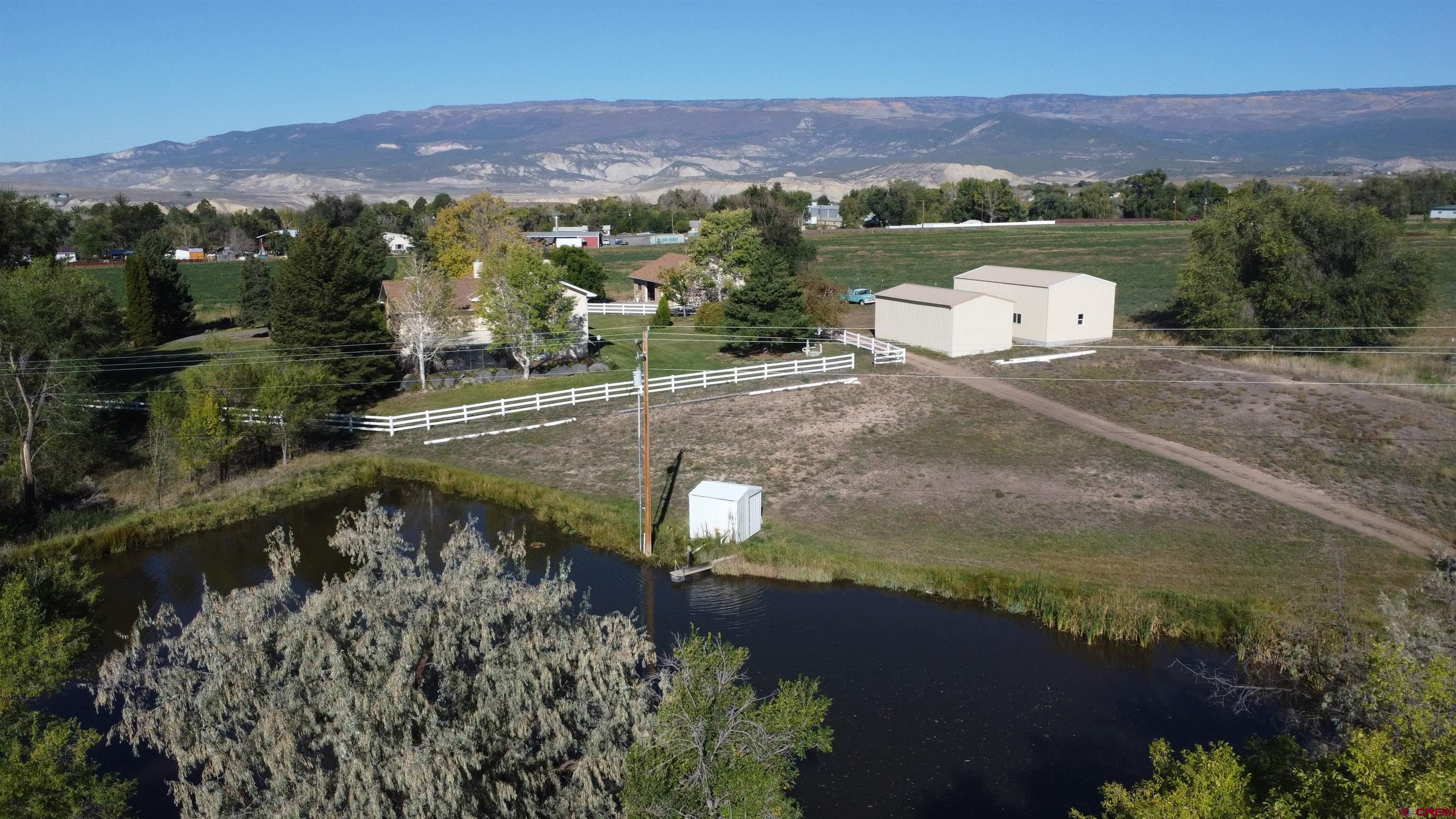 21855 Newland Road Eckert, CO 81418 - Photo 6 of 13 an aerial view of a house with a garden