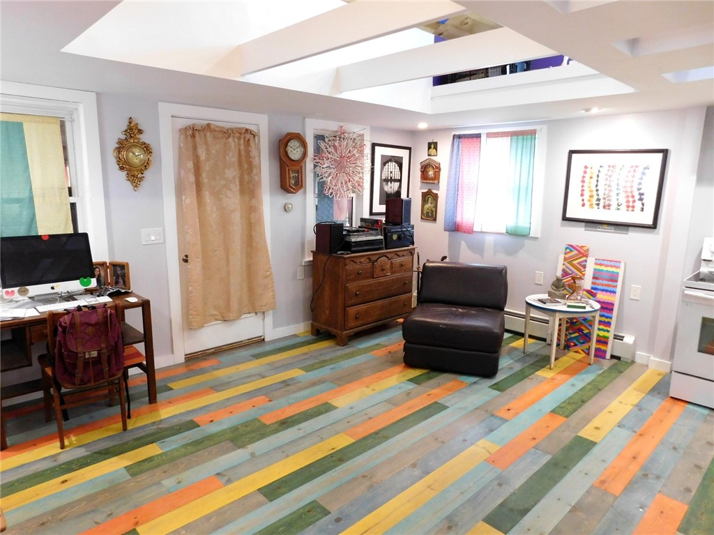 63 Echo Road Glocester, RI 02814 - Photo 3 of 17 Open living area/Lost Storage/Stained red pine floors