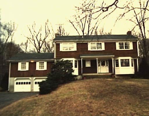 249 West Norwalk Road Norwalk, CT 06850 - Photo 1 of 1 a front view of a house with yard and trees