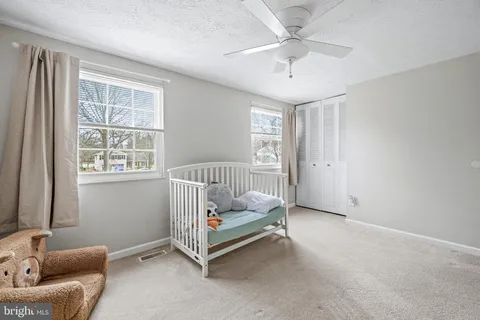 a view of a workspace with furniture and wooden floor
