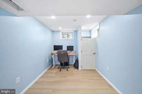 a bathroom with a toilet a sink and a mirror