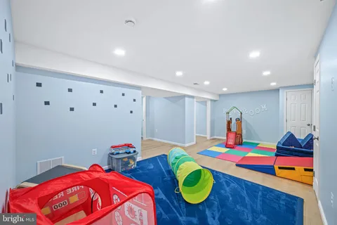 a room with furniture and a wooden floor