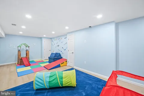 a room with furniture and a flat screen tv