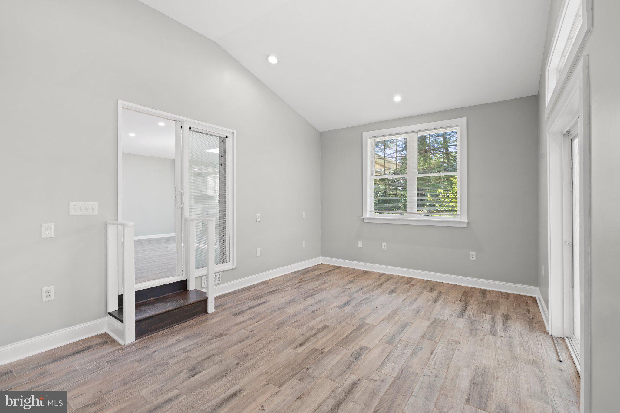 8405 Shirley Road Spotsylvania, VA 22551 - Photo 7 of 42 an empty room with wooden floor and window