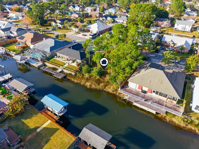 an aerial view of a house with a lake view