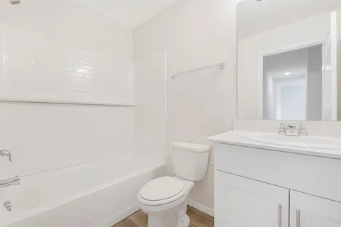 a bathroom with a sink a toilet and a bathtub