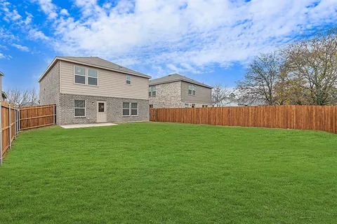 a house view with a garden space
