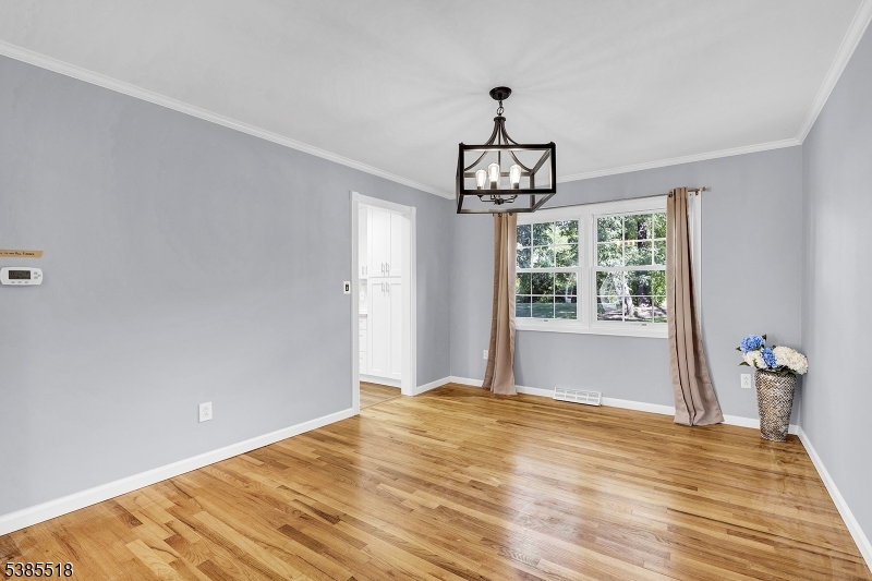 42 Stonewyck Road Chatham, NJ 07928 - Photo 19 of 35 a view of an empty room with wooden floor and a window