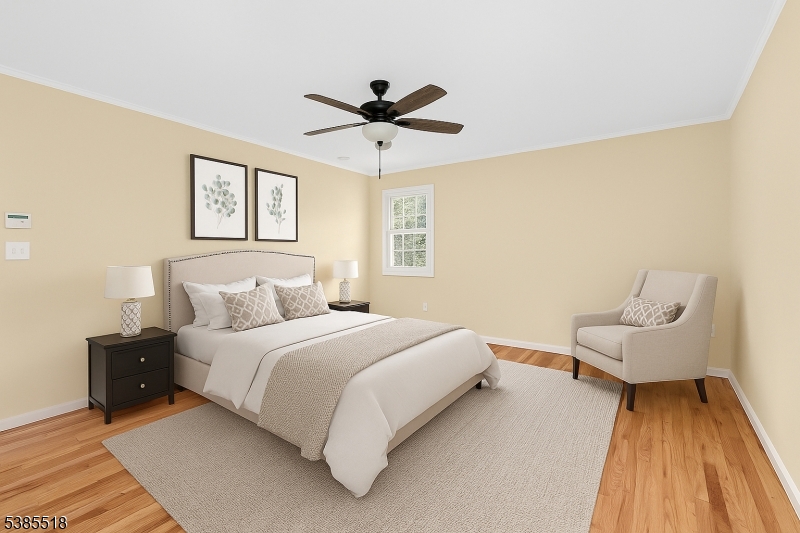 42 Stonewyck Road Chatham, NJ 07928 - Photo 23 of 35 a bedroom with a bed and a couch