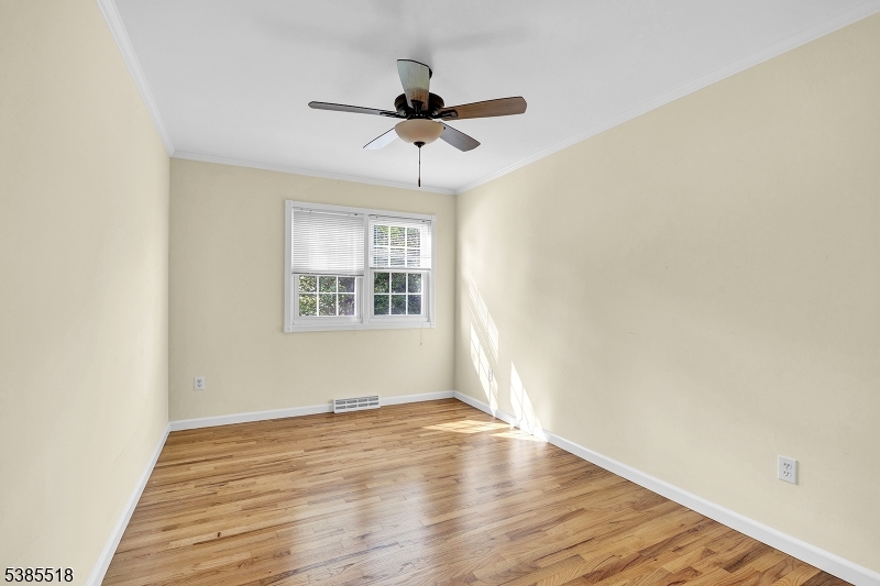 42 Stonewyck Road Chatham, NJ 07928 - Photo 27 of 35 a view of empty room with wooden floor and fan