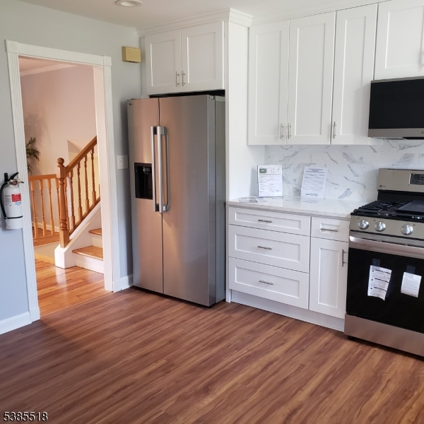 42 Stonewyck Road Chatham, NJ 07928 - Photo 33 of 35 a kitchen with stainless steel appliances a refrigerator and a stove top oven