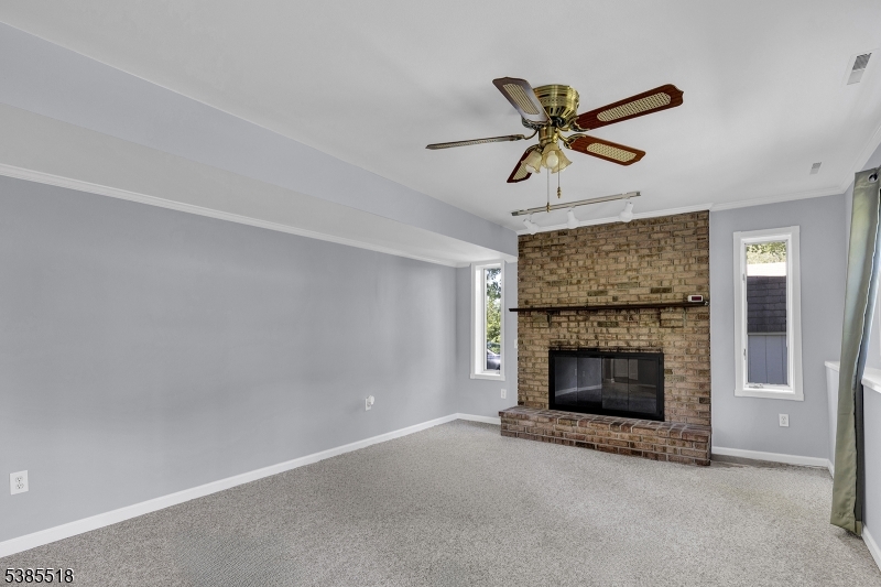 42 Stonewyck Road Chatham, NJ 07928 - Photo 9 of 35 a living room with fireplace
