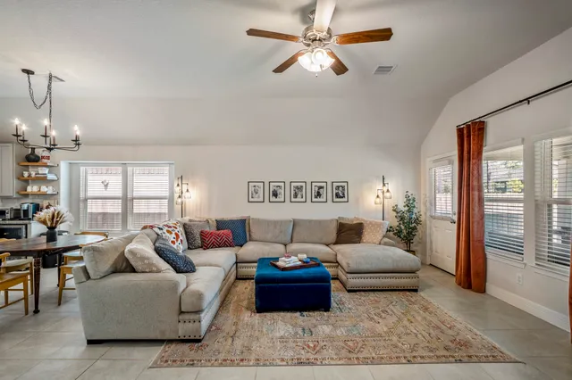 a living room with furniture and a rug