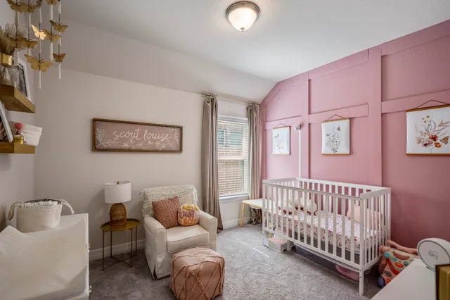 a bedroom with furniture and a window