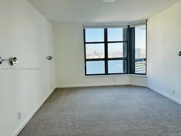 an empty room with a fireplace