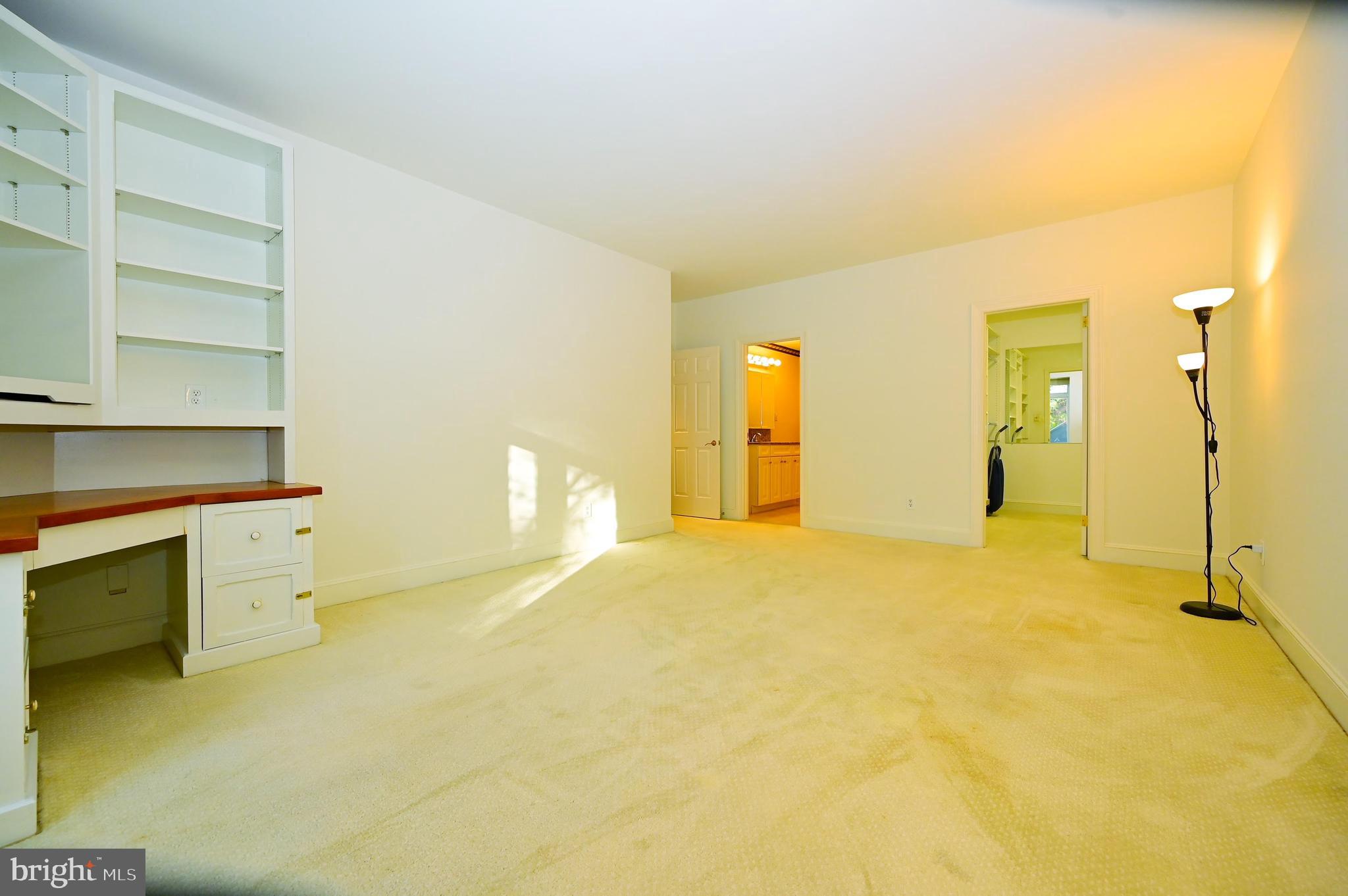 414 Old Lancaster Road, Unit 103 Haverford, PA 19041 - Photo 19 of 38 Primary Bedroom w/ Built-in Desk/Shelves