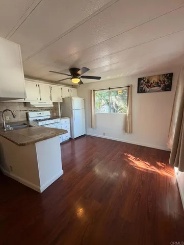 a kitchen with sink cabinets and window