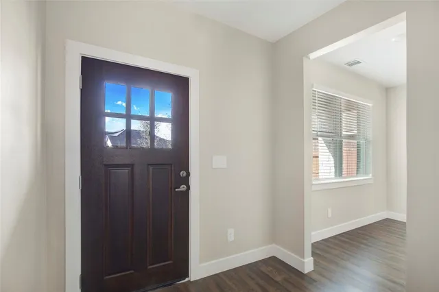 a view of an entryway of wooden floor