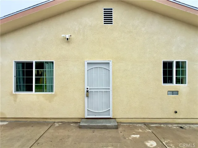 a view of kitchen electric appliances cabinets and wooden floor