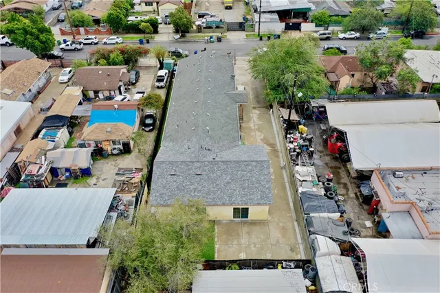 an aerial view of a house with a yard