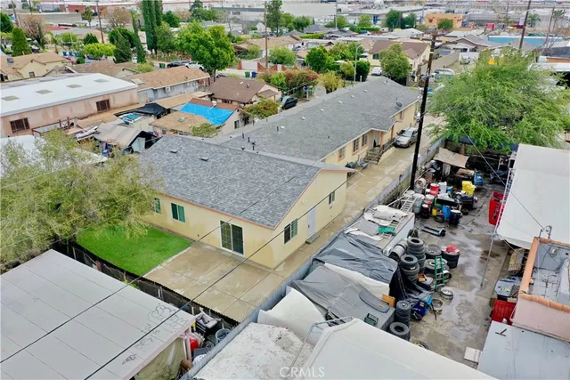 a aerial view of a house with a garden and trees