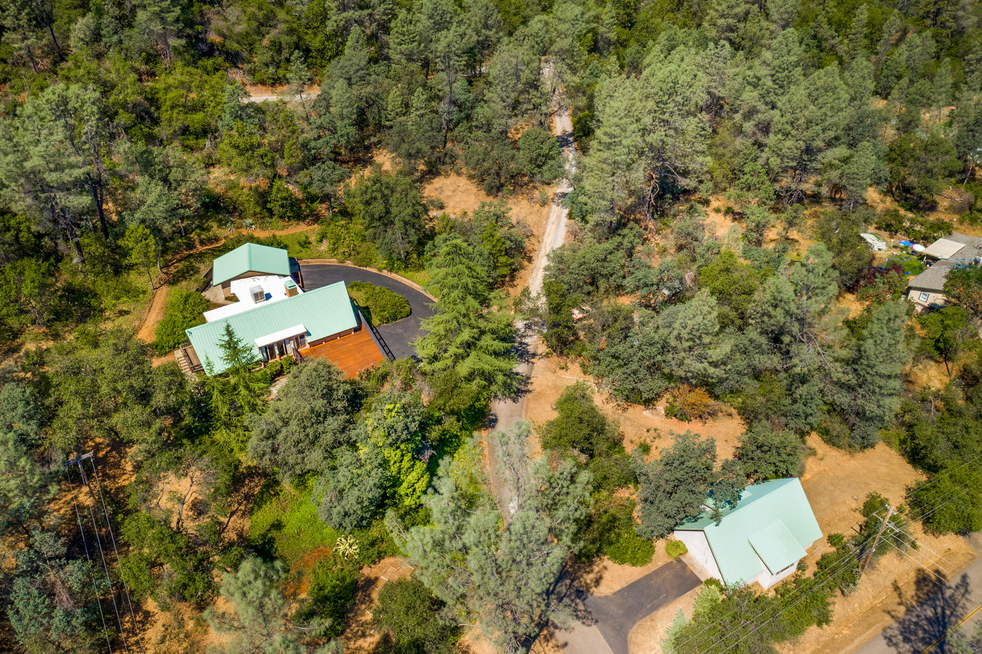 17823 Press Road Redding, CA 96003 - Photo 2 of 33 an aerial view of a house with a yard and lake