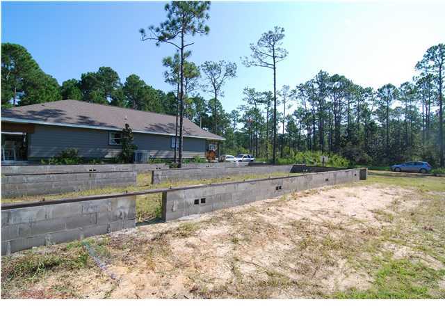Lot 4 3rd Street Santa Rosa Beach, FL 32459 - Photo 3 of 6 a backyard of a house with lots of green space