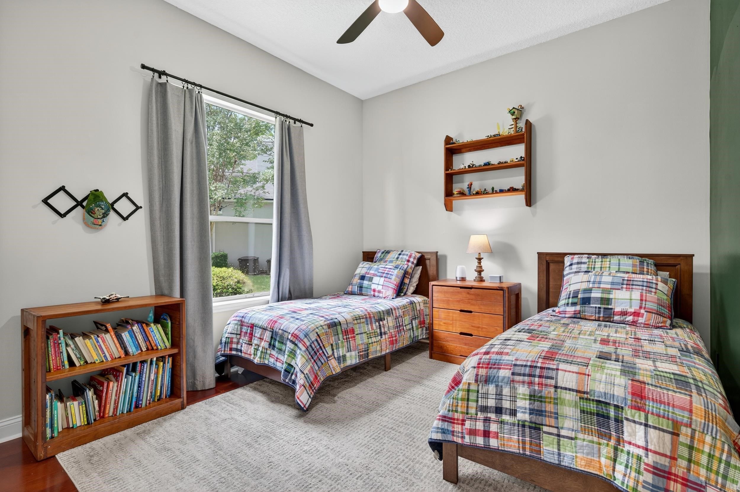 641 Pelham Road St. Augustine, FL 32092 - Photo 31 of 62 a bedroom with two beds and a book shelf