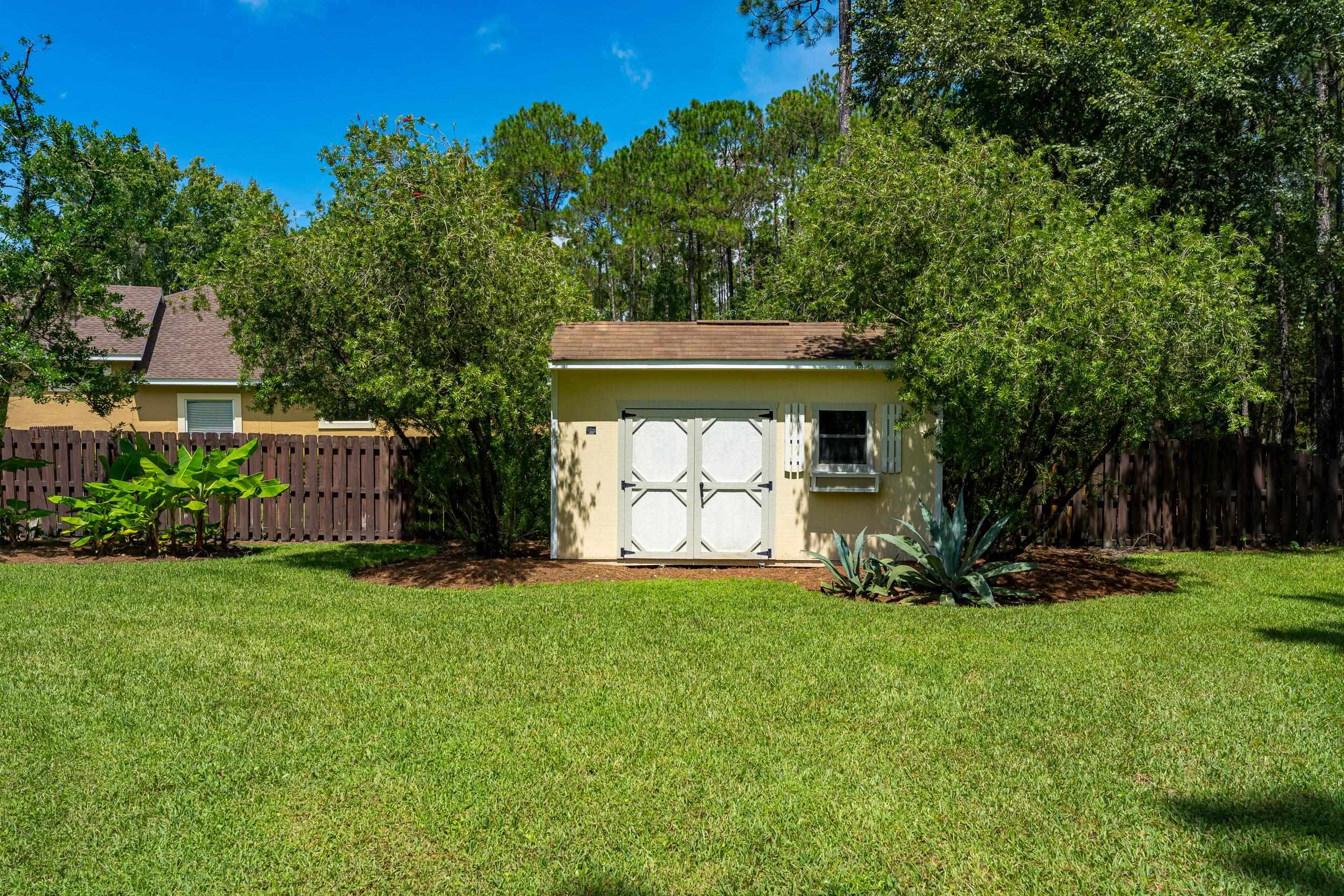 641 Pelham Road St. Augustine, FL 32092 - Photo 43 of 62 View of yard with a storage unit