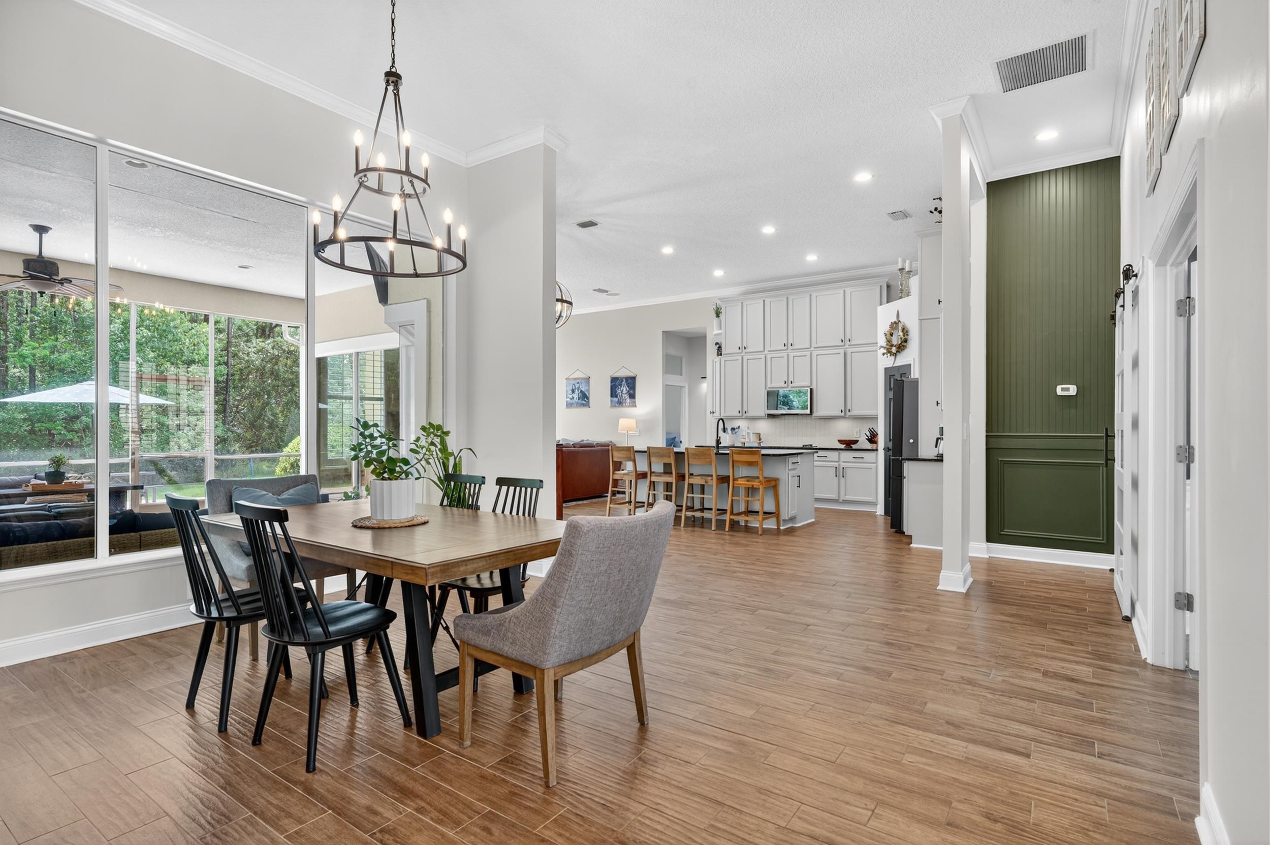 641 Pelham Road St. Augustine, FL 32092 - Photo 6 of 62 a view of a dining room with furniture window and wooden floor