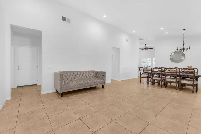 a view of work space with furniture and windows