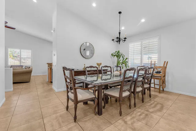 a dining room with furniture and window