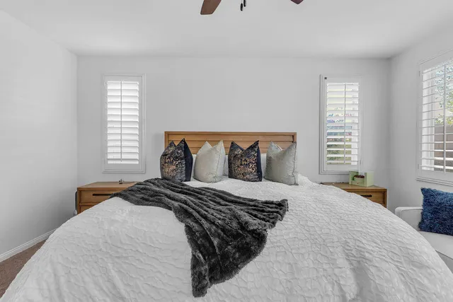 a bedroom with a bed and window