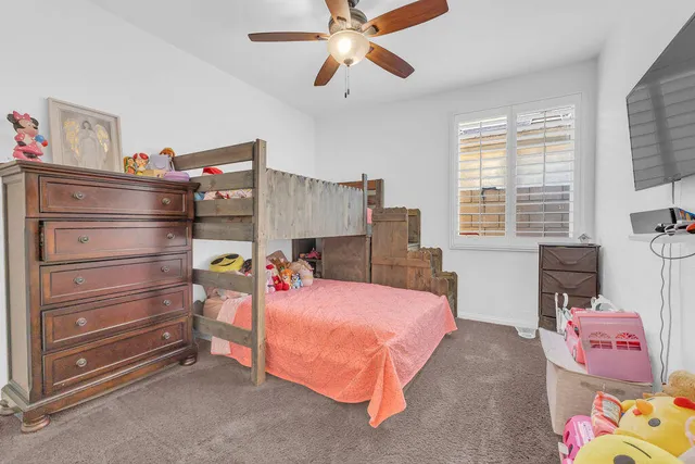 a bedroom with a bed and furniture