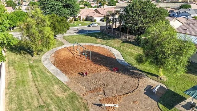 a view of a swimming pool with a yard and seating area