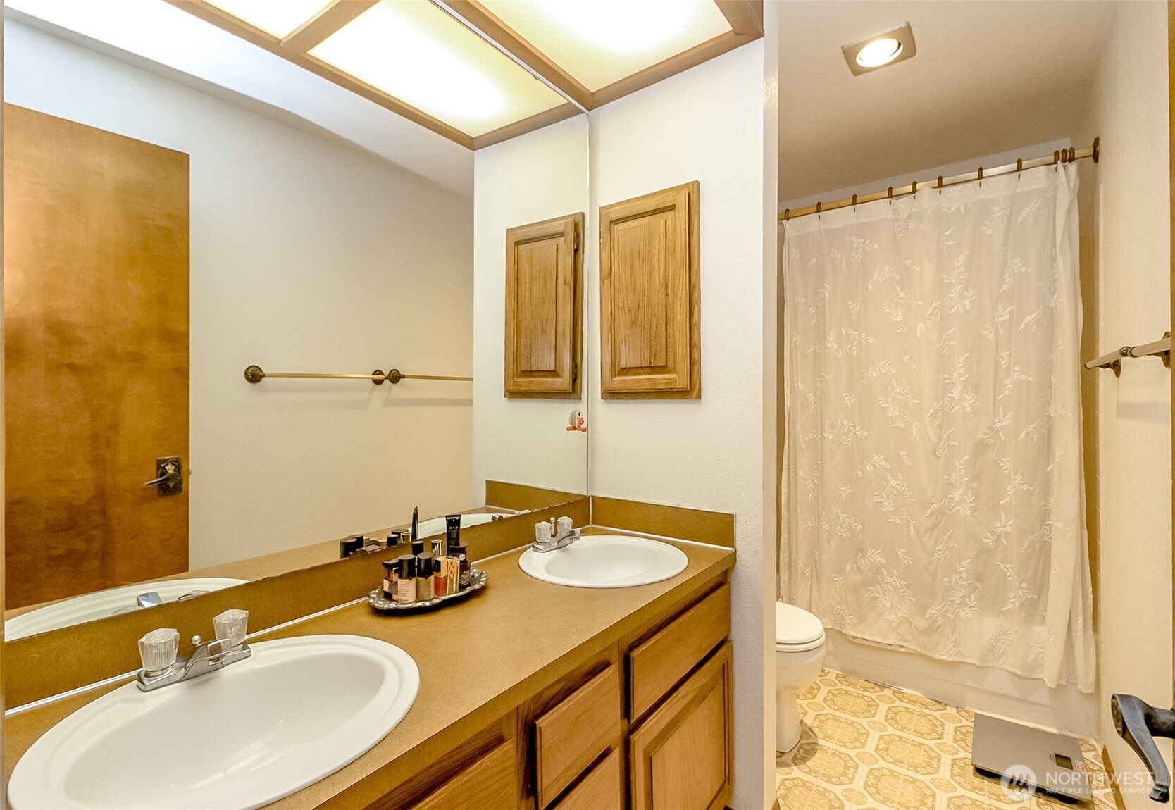 22121 4th Avenue Southeast Bothell, WA 98021 - Photo 20 of 22 a bathroom with a sink double vanity and a mirror