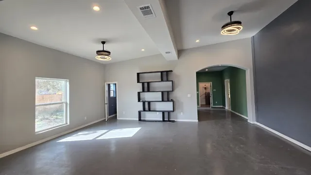 a bathroom with a toilet a sink and shower