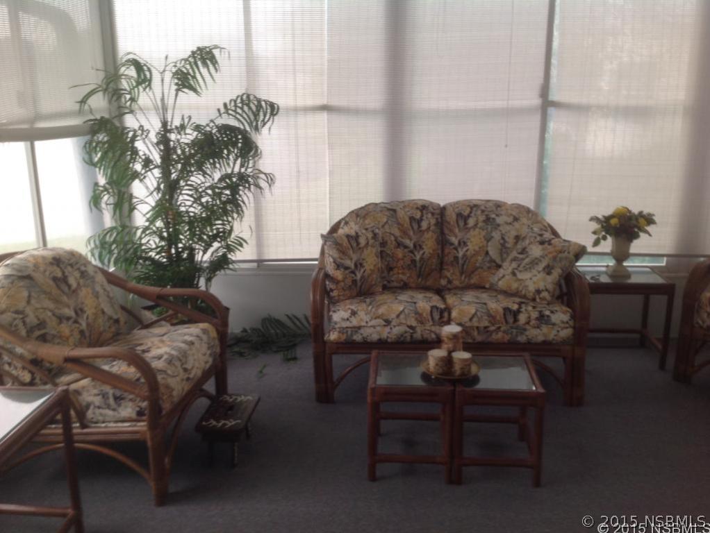 744 Navigators Way Edgewater, FL 32141 - Photo 5 of 6 a living room with furniture and a potted plant